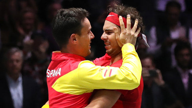 Roberto Bautista Agut and Rafael Nadal celebrate Spain's Davis Cup win.