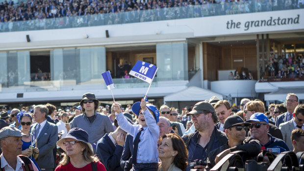 Crowd favourite: Winx is cheered on the Flemington crowd.