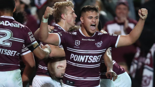 Josh Schuster celebrates a Manly try.