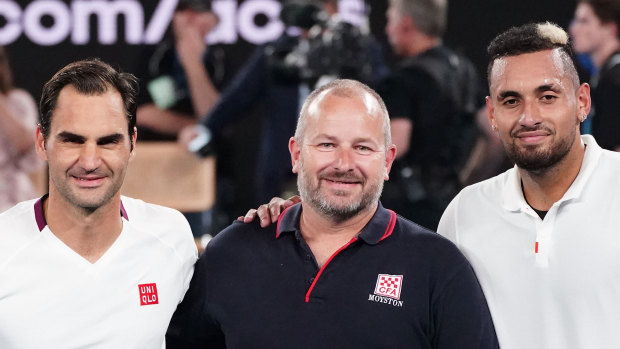 Roger Federer and Nick Kyrgios with firefighter Alistair Mason.