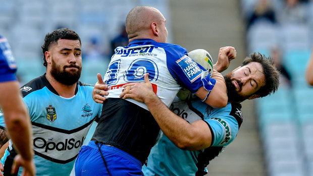 Bulldogs enforcer David Klemmer goes head-to-head with short-lived team-mate Aaron Woods, who was a demon for the Sharks.
