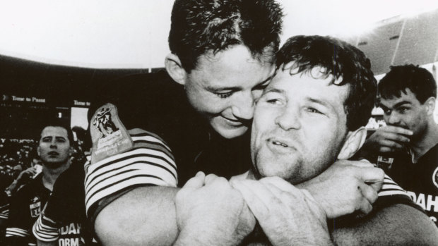 Royce Simmons celebrates the 1991 grand final win with Mark Geyer.