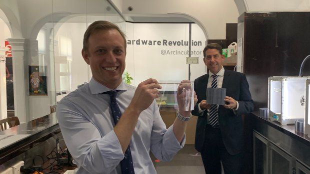 Queensland Health Minister Steven Miles (front) and State Development and Manufacturing Minister Cameron Dick with the components of the newly sourced face shields at the Herston Biofabrication Institute.