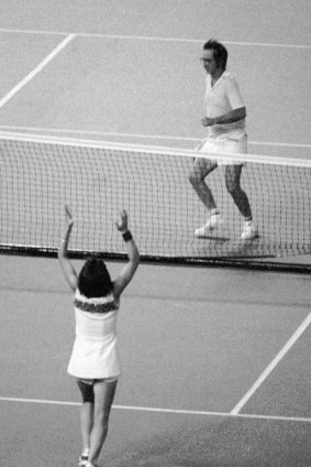 Billie Jean King raises her arms after defeating Bobby Riggs in the 'Battle of the Sexes' in 1973. 