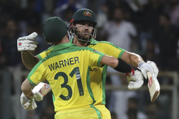 Aaron Finch and David Warner celebrate after winning the opening ODI.