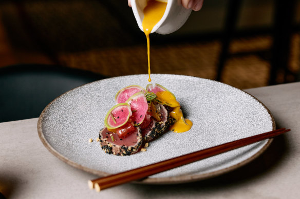 Azteca’s yellowfin tuna tiradito with citrus, sesame, peanut, aji mirisol and radish.