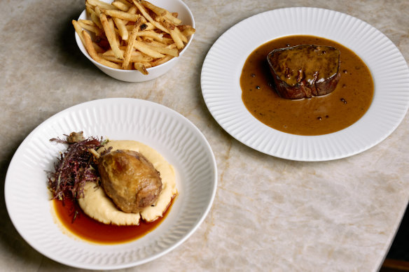 Confit duck with potato mash and a duck jus, and grass-fed eye fillet with pepper cognac sauce and French fries.