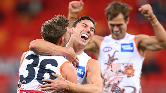 Isaac Cumming celebrates kicking a goal.