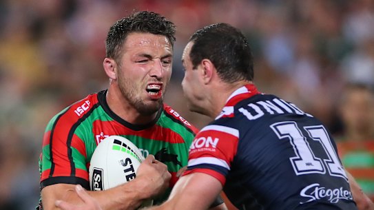 Sam Burgess (left) in action during Friday night's fiery clash with the Roosters.