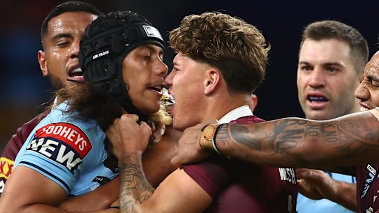 Reece Walsh and Jarome Luai at close quarters.