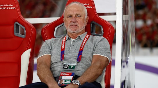 Graham Arnold deals with more dejection against Indonesia from the dugout in Jakarta.
