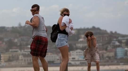 A gale-force southerly buster ambushes beach goers at Bondi.