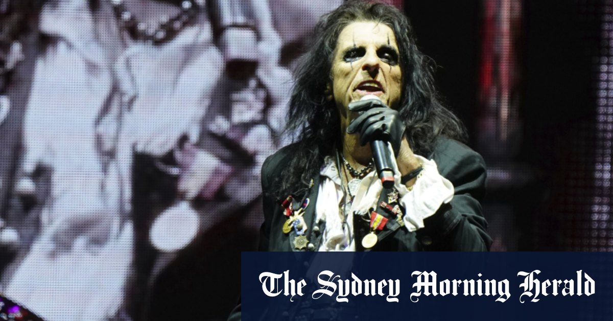 Everyone feared this festival would implode, but there’s Alice Cooper waving a boa constrictor on stage