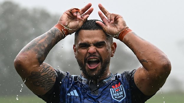 Soggy, but happy: Latrell Mitchell in NSW camp.