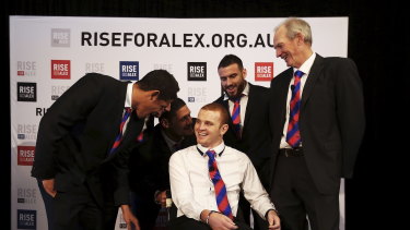 Then Knights players Dane Gagai, Korbin Sims, Willie Mason and Darius Boyd share a joke with Bennett and McKinnon.