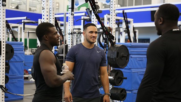 Holmes (centre) faces some tough opposition in his bid to make a roster.