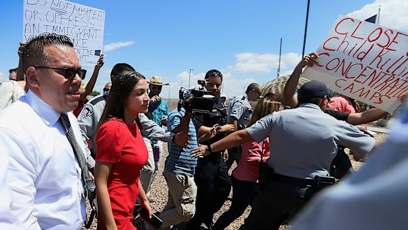 Ocasio-Cortez was escorted back to her vehicle after she spoke at the facility. 