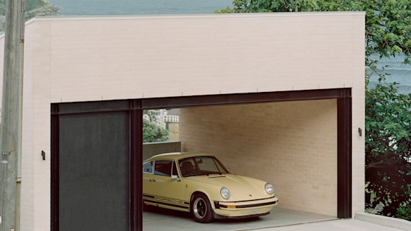 The garage – also used as a gymnasium – is at the crest of the site and accessed by a secondary road.