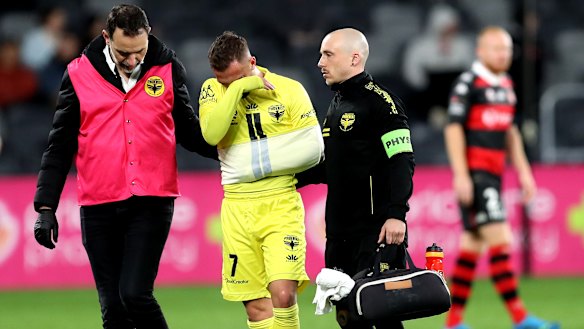 Reno Piscopo leaves the field after a scything tackle from Ziggy Gordon.