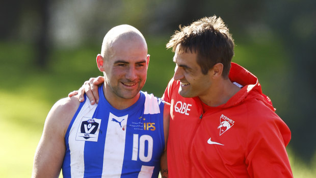 Cunnington with Sydney’s Josh Kennedy, who suffered a suspected hamstring injury during the VFL clash.
