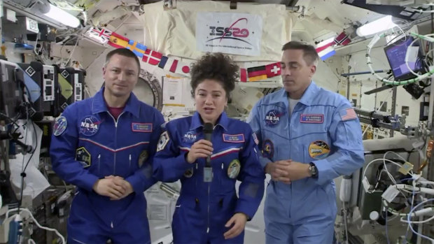 US astronaut Jessica Meir speaks, accompanied by Andrew Morgan and Chris Cassidy, during a news conference held by the American members of the International Space Station.