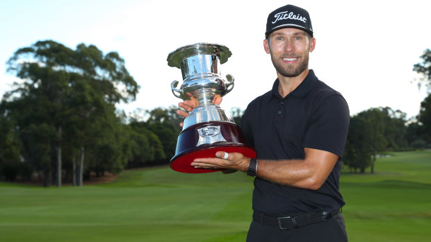 Bryden Macpherson poses with the trophy after winning the NSW Open.