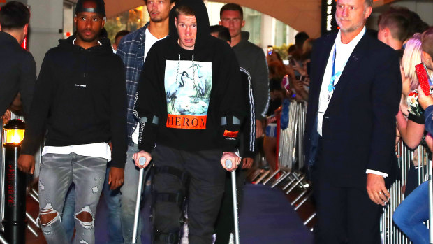Sidelined: An injured Kevin De Bruyne arrives for the premiere of a documentary on Manchester City.
