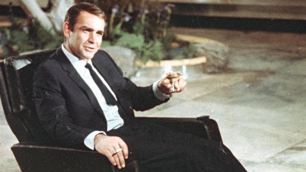 The glass has changed, but Bond's drink of choice has remained the same. Sean Connery sips a martini as James Bond.