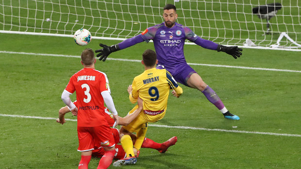 Halving the deficit: Jordan Murray beats City keeper Dean Bouzanis to put the Mariners back in the hunt.