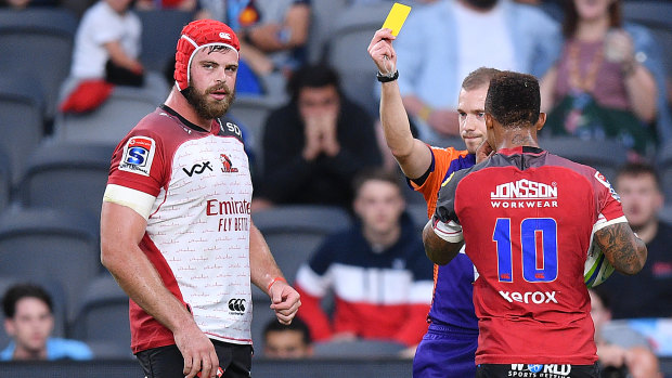 Schoeman receives a yellow card for striking Rob Simmons in Friday's match at Bankwest Stadium. 