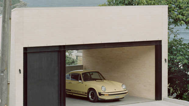 The garage – also used as a gymnasium – is at the crest of the site and accessed by a secondary road.
