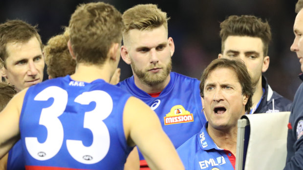 Barking out commands: Luke Beveridge gets the message to his players.