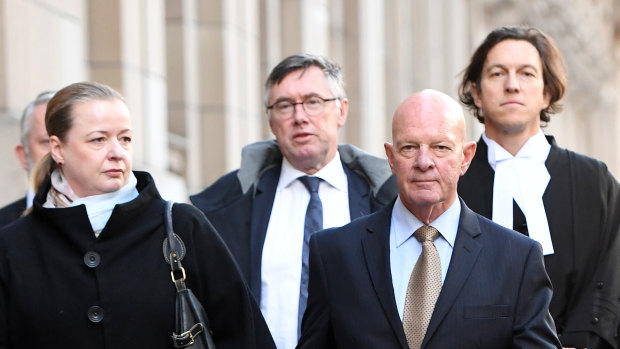 Clifford John Gerathy (second from right) leaves the Supreme Court in Melbourne earlier this year.