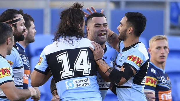 Cronulla celebrate a try by prop Andrew Fifita (middle).
