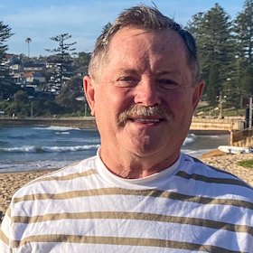 Kevin Young at Dee Why Beach on Sunday morning, 12 years after he lost his own son Zac in a shark attack.