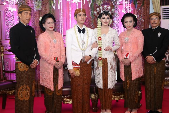 From left, Indonesian President Joko Widodo, his wife Iriana, their son Gibran Rakabuming Raka and his bride Selvi Ananda, with Selvi’s father Didit Suprijadi and mother Sri Partini in 2015.