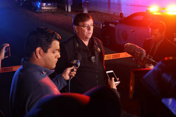 Fresno Police Lt Bill Dooley speaks to reporters at the scene of a shooting at a backyard party.