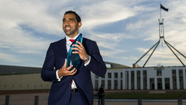 Off-field impact: Adam Goodes accepting his Australian of the Year award in 2014.