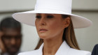 White lady ... Melania Trump in a Michael Kors suit and custom-made hat.