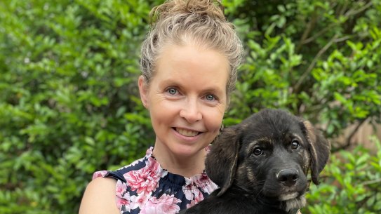 UQ researcher Dr Katrina Moss with her dog Buddy