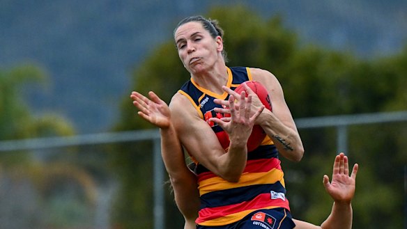 Adelaide AFLW veteran Chelsea Randall takes a strong grab on Sunday against Geelong.