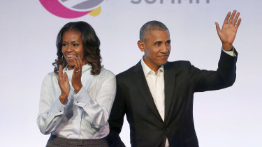 former President Barack Obama, right, and former first lady Michelle Obama appear at the Obama Foundation Summit in Chicago in 2017. 
