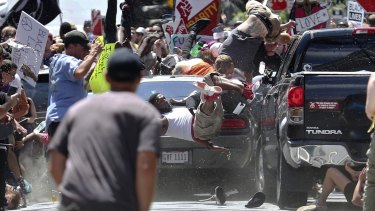 People fly into the air as James Alex Fields jnr's vehicle is driven into a group of protesters in Charlottesville. 