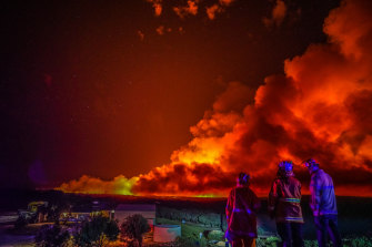 Firefighters at the scene of the blaze near Margaret River in Western Australia in December. Heatwaves and bushfires will increase and global temperatures rise. 