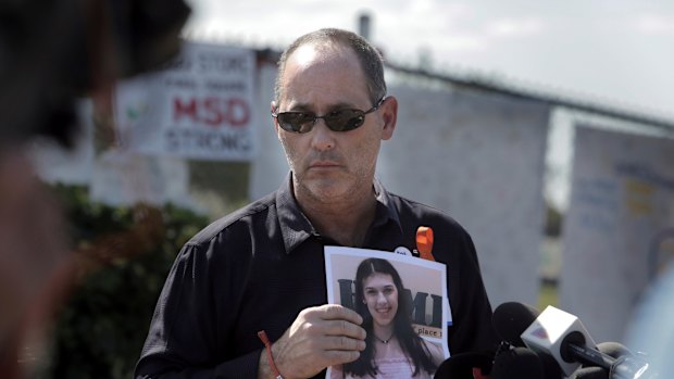 Fred Guttenberg holds a picture of his daughter Jamie, killed in a high school shooting. 