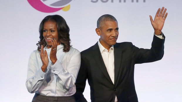 Former president Barack Obama, right, and former first lady Michelle Obama appear at the Obama Foundation Summit in Chicago in 2017. 