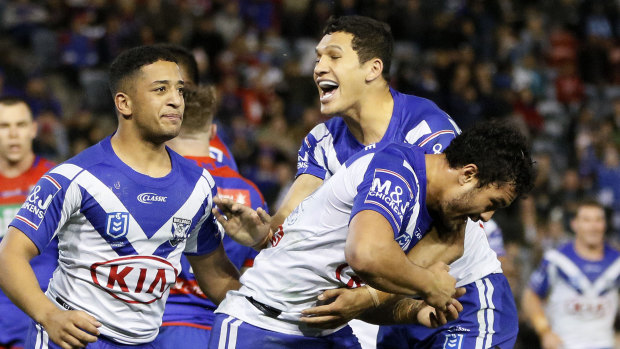 Come-from-behind win: Dallin Watene-Zelezniak congratulates Corey Harawira-Naera after the Bulldogs' second try.