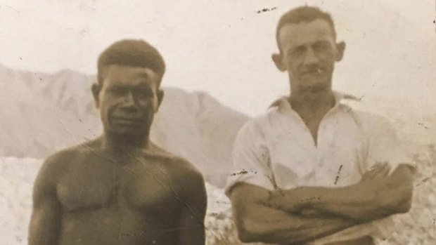 Tom Phelps (r) with his friend Una Beel in New Guinea before their village was bombed by the Japanese.