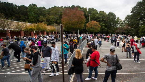 Hundreds of people wait in line for early voting in Marietta, Georgia.