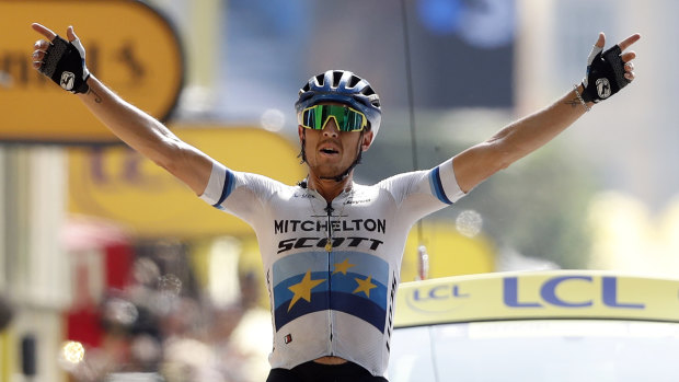 Italy's Matteo Trentin celebrates as he crosses the finish line to win stage 17.